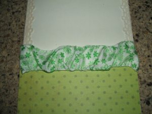 Gathered ribbon across center of card.