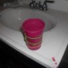 Rubber bands on cup to prevent spills.