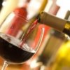 Pouring red wine into a glass.
