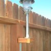 Attach solar garden lights to your fence.