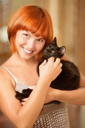 Woman holding a cat.