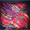 Pillows covered with scarves.