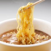 Ramen Noodles Being Lifted by Chopsticks