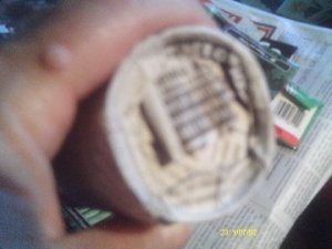 The finished bottom of the newspaper pot.