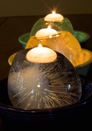 Melting Ice Candles in Bowls in a Row