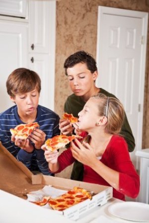 Teens Eating Pizza
