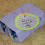 Filled egg crate with gift tag.