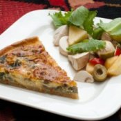 Quiche Being Served on White Plate