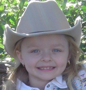 little girl in cowgirl hat