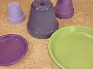 Painted terra cotta pots and saucers.