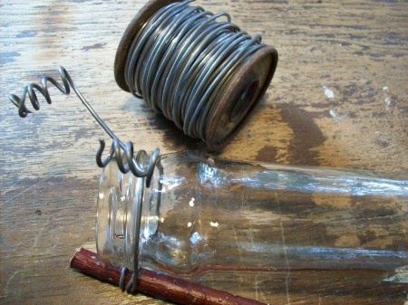 Attaching wire to the jar.
