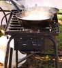 Cooking over a camp stove
