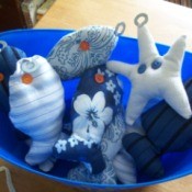 Homemade fishing game view of the finished fish and starfish in bucket.
