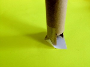 Affix paper to end of the tube.