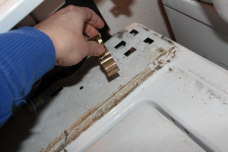 Remove clips from washing machine cover