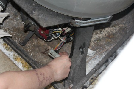 Disconnect wires from washing machine motor