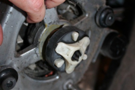 Close up of motor coupling as attached to motor in Kenmore washing machine