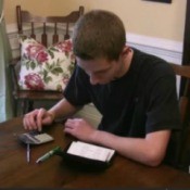 Student Calculating College Costs