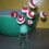 Red and white button flowers in salt shaker.