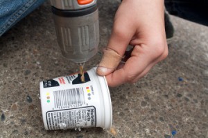 Drilling Wick Holes in Yogurt Container