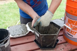 Filling Recycled Planter with Concrete