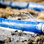 Photo of a leaky water hose.