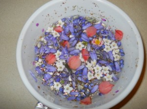 Bowl with floating flowers and added glitter.