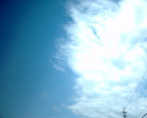 Split sky with clouds and blue half.