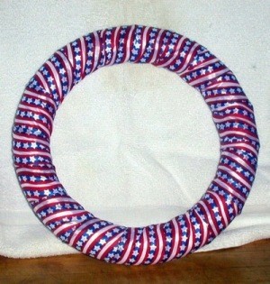 Foam wreath wrapped with ribbon.