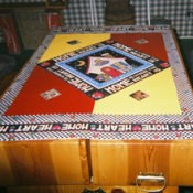 Sheet vinyl scrap decorated to be used as table cover.