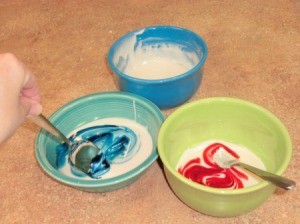 Mixing food color into frosting.