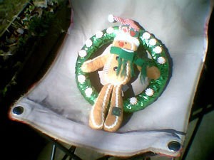 Wreath with gingerbread man in the center.