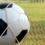 Closeup of soccer ball in goal.