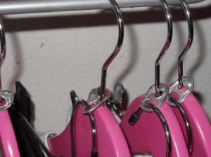 Hang another on an existing hanger using a pop can tab.