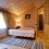 Wood paneled bedroom.