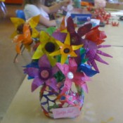 Flowers made from the bottoms of plastic bottles.
