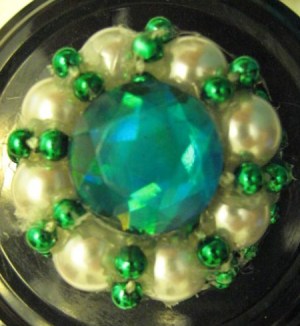 Light blue, pearl, and green bead arrangement.