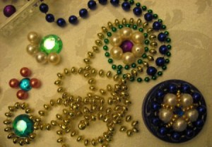 Strings of beads, motifs, and completed lid.