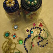 Two jars with finished lids, motifs, and beads.