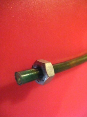 Closeup of the tubing with the nut attached.