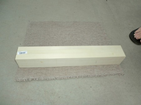 Attaching carpet to post.