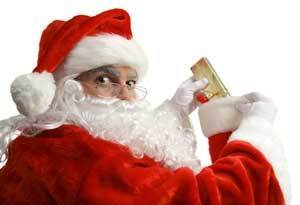 Santa putting a gift in a stocking