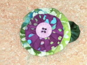Finished top view of green and purple barrette.