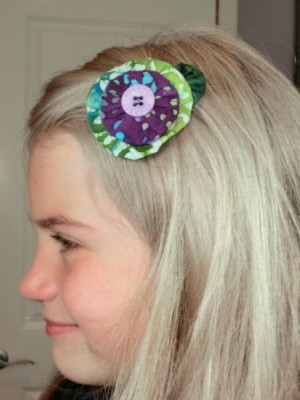 Our Thriftyfun model wearing the green and purple barrette.