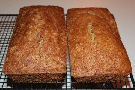 2 loaves of zucchini bread cooling on rack