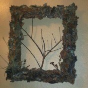Bark covered picture frame with additional twigs added for interest.
