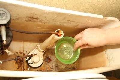 Scooping Out Tank Water