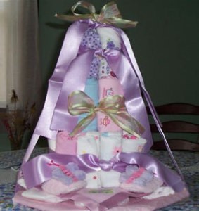 Shower cake made with diapers and onesies.