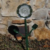Recycled materials make a garden flower.