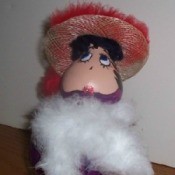 Gourd painted and decorated to look like Betty Boop.